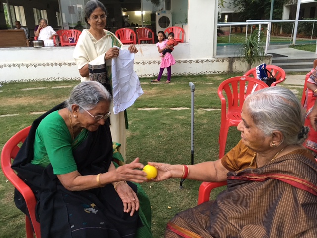 Residents and staff playing games at SMILES . 
