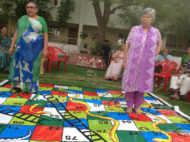 SNAKES AND LADDERS GAME PLAYED BY RESIDENTS AND EMPLOYEES at SMILES 